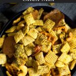 Dill Pickle Chex Mix in a dark bowl on a light linen napkin.