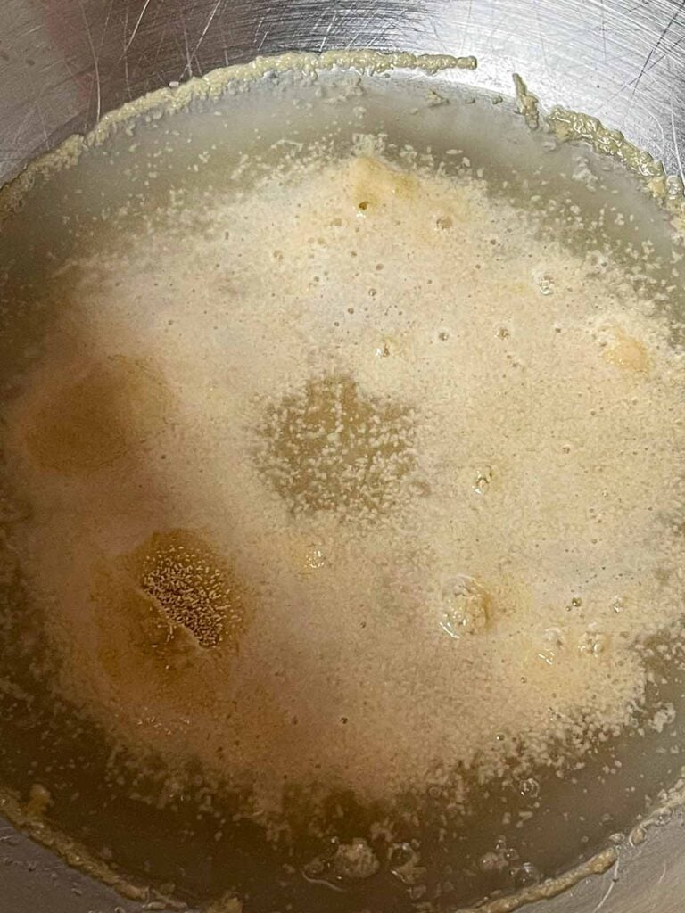 Yeast blooming in a stand mixer bowl.