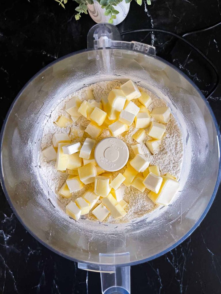 Ingredients for pie crust dough in a food processor