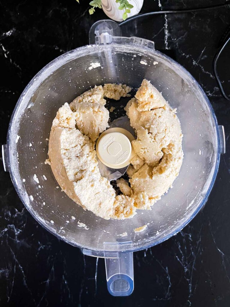 Pie crust dough in a food processor.