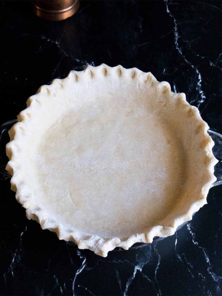 Pie dough shaped into a pie plate.