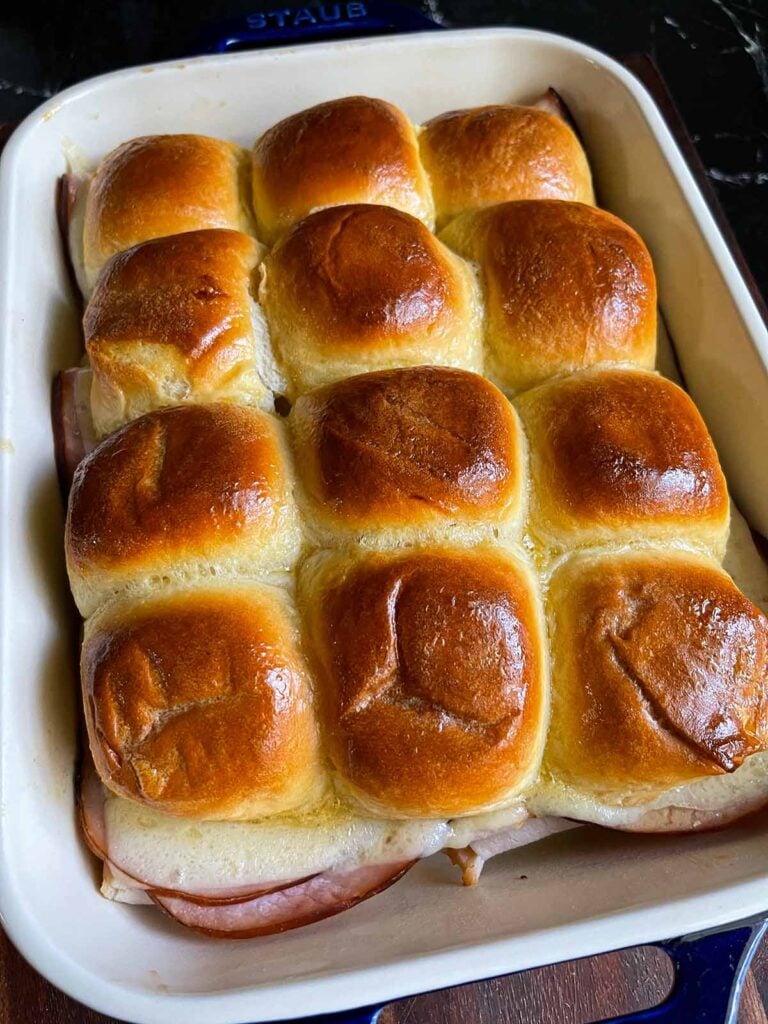 Cooked Monte Cristo sliders in a baking dish.