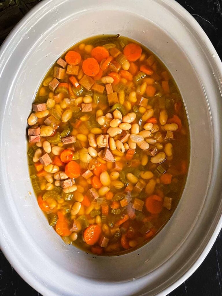 Ham and bean soup in a slow cooker.