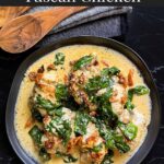 Slow Cooker Tuscan Chicken in a dark bowl on a dark surface.