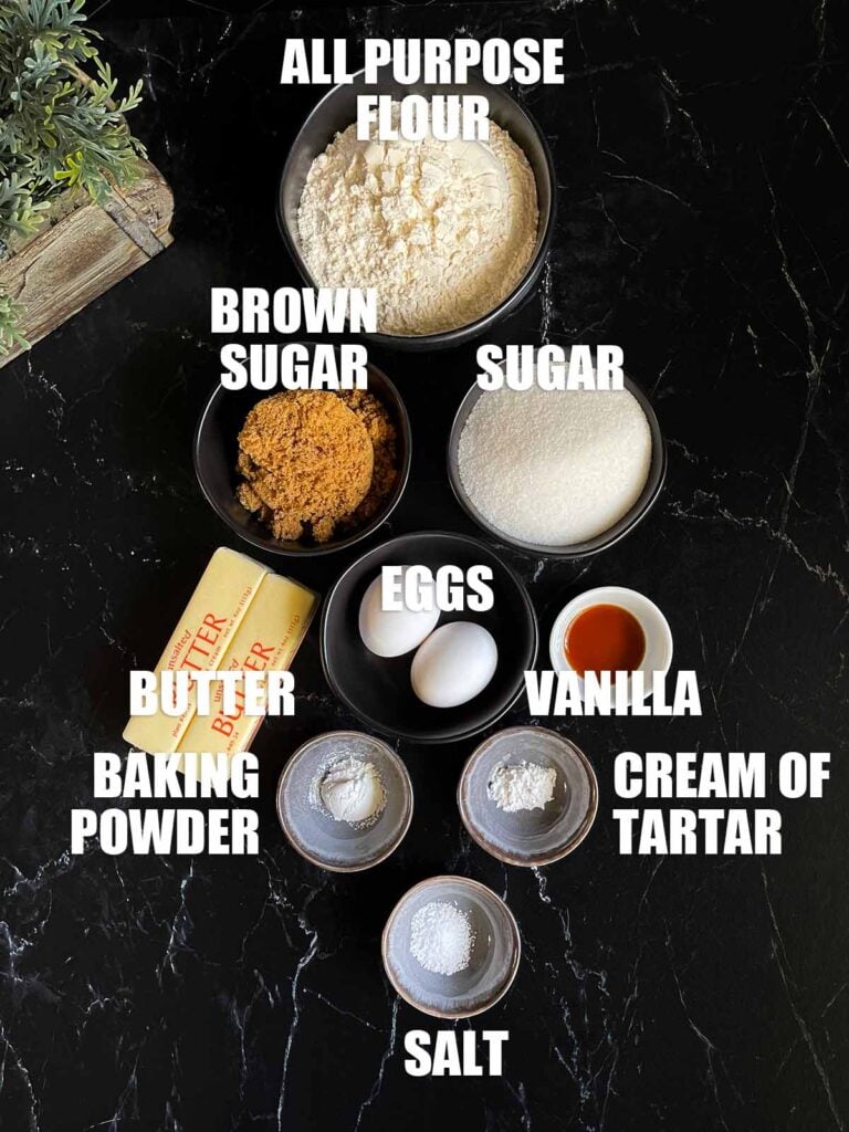 Ingredients needed to make snickerdoodle bars on a dark surface.
