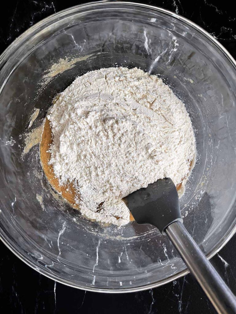 Dry ingredients added to the wet ingredients for Snickerdoodle bars.