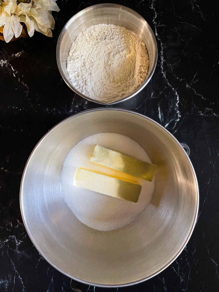 Ingredients for old fashioned sour cream pound cake in mixing bowls.