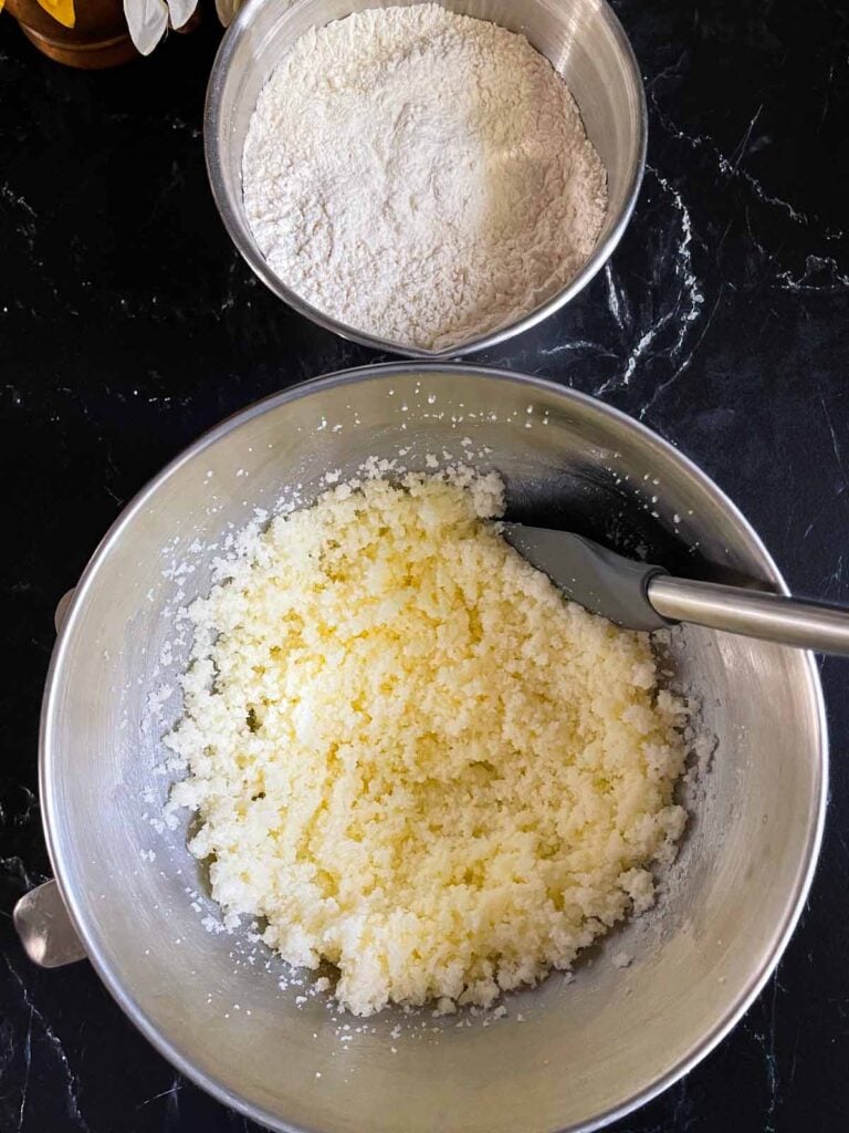 Butter and sugar creamed together in a metal bowl for sour cream pound cake.