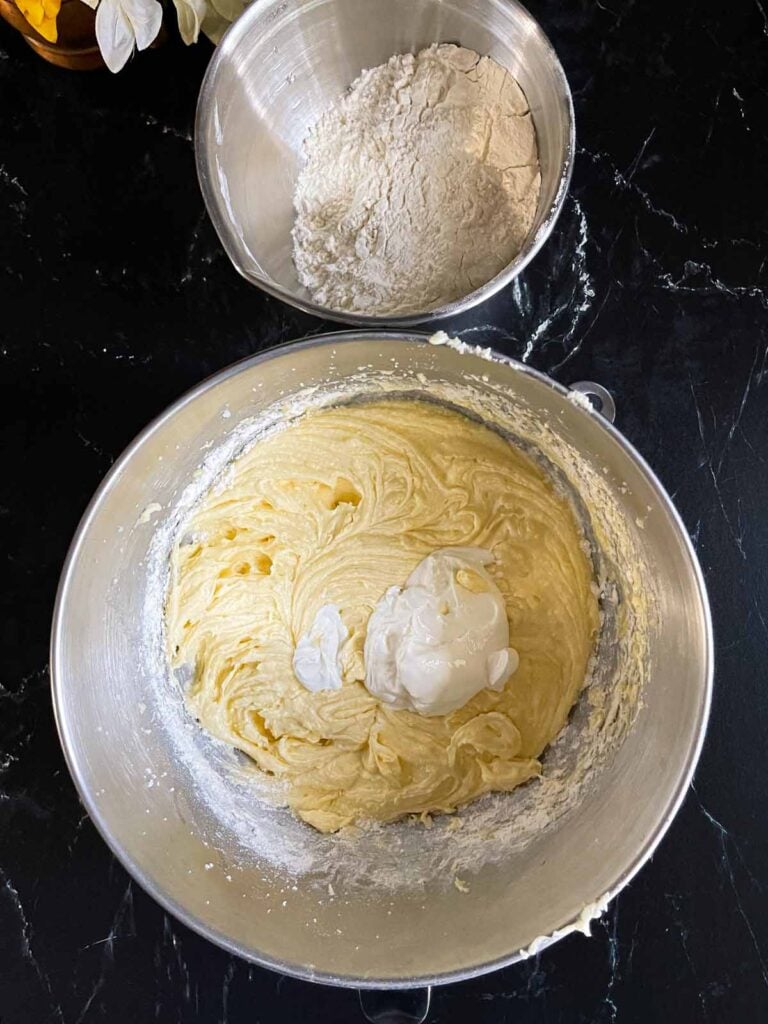 Ingredients for old fashioned sour cream pound cake in mixing bowls.