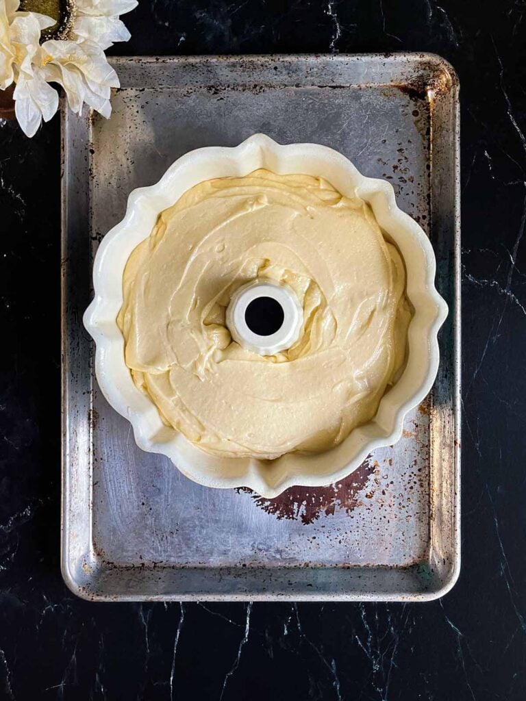 Old fashioned sour cream pound cake batter in a bundt cake pan.