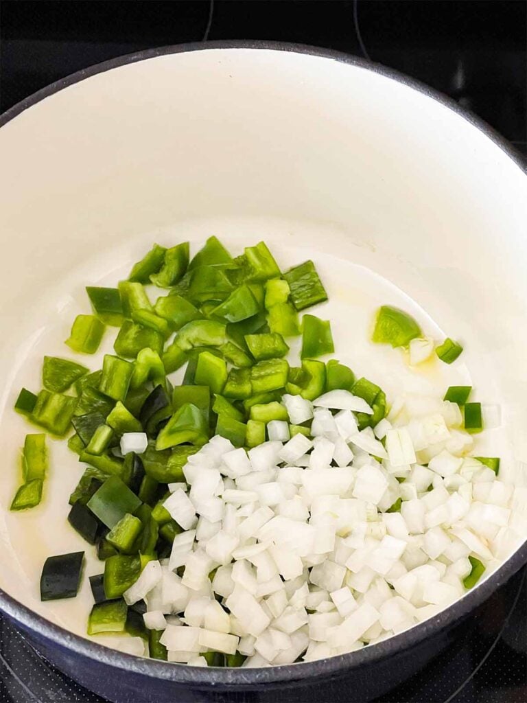 Onion, poblano, and jalapeno in a dutch oven.