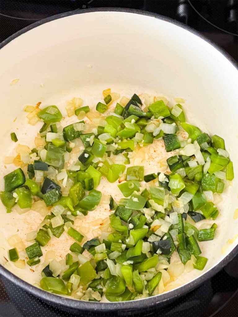 Vegetables cooking in a dutch oven.