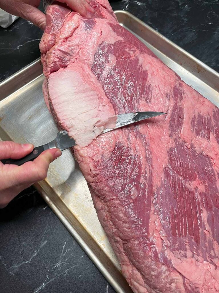 Trimming the deckle out of the brisket.