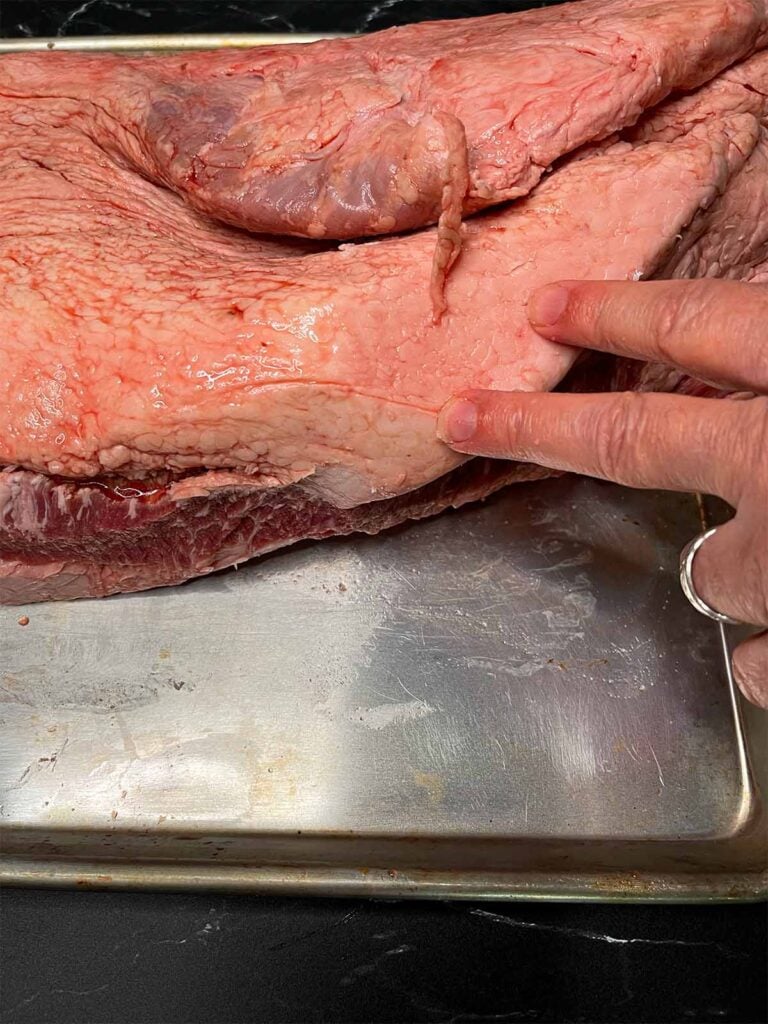 Showing where the big sections of fat is on a brisket.