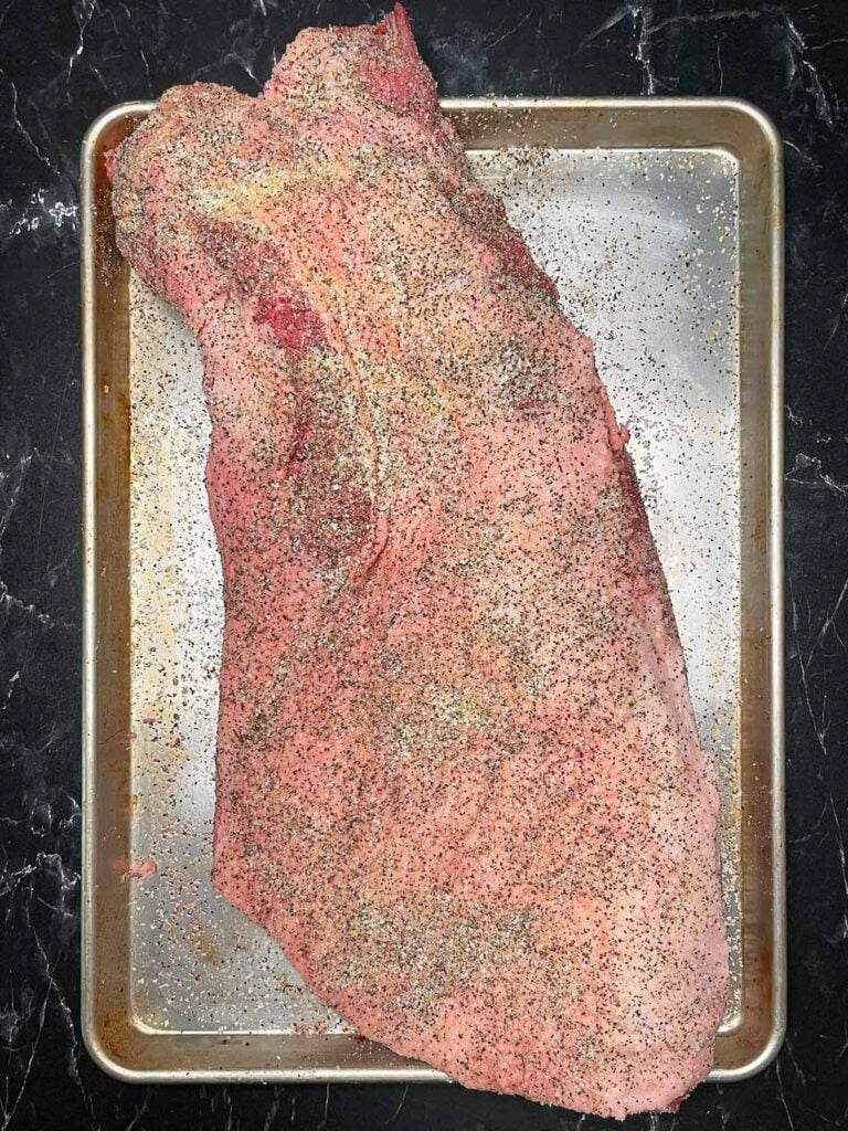A rubbed brisket, fat side up.