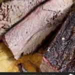 Slices of smoked brisket on a cutting board.