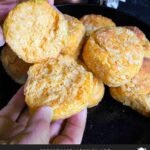 Sweet potato biscuits in a red lined cloth basket.