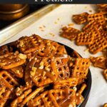 Butter toffee pretzels in a dark bowl on the baking sheet.