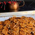 Butter toffee pretzels on a parchment paper lined baking sheet.