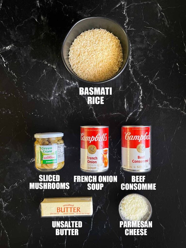 Basmati rice risotto ingredients on a dark surface.