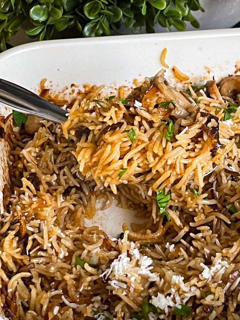 Basmati rice risotto (stick of butter rice) in a casserole dish.