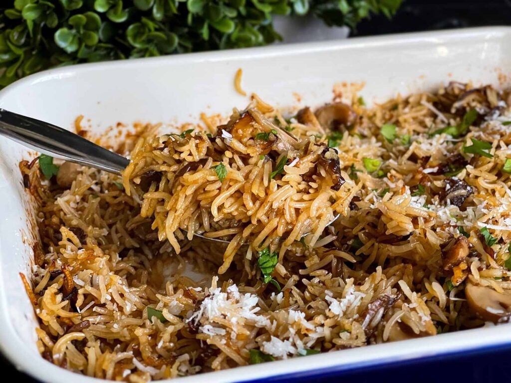 Basmati rice risotto (stick of butter rice) in a casserole dish.