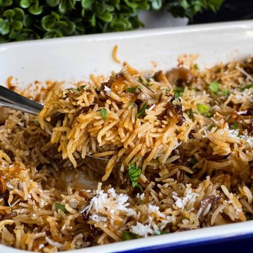 Basmati rice risotto (stick of butter rice) in a casserole dish.