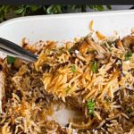 Basmati rice risotto (stick of butter rice) in a casserole dish.