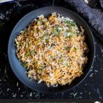 Basmati rice risotto (stick of butter rice) in a casserole dish.