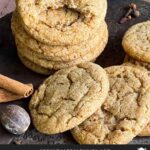 Chai sugar cookies stacked on an old metal cake pan.