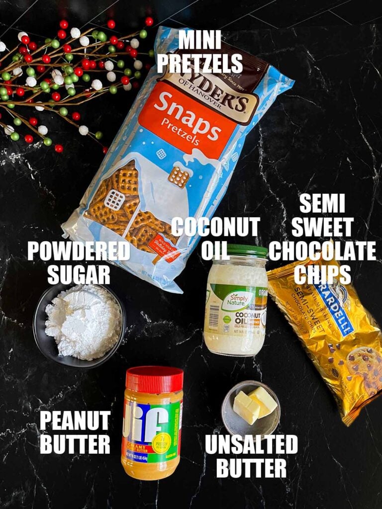 Ingredients for peanut butter pretzel bites on a dark surface.