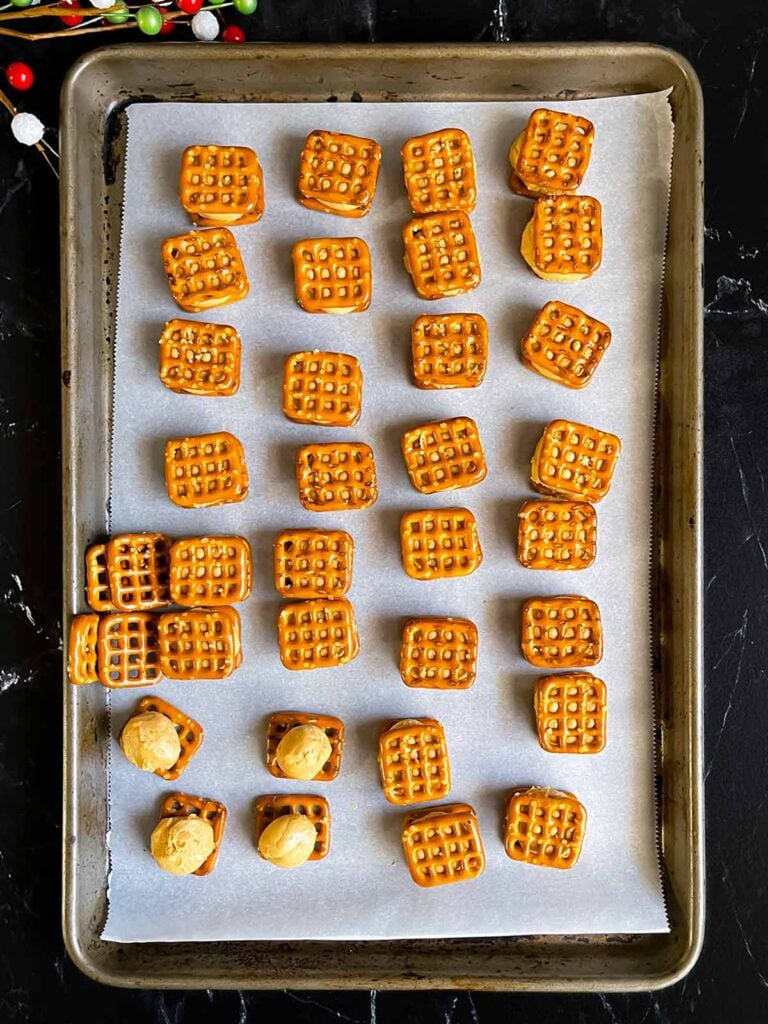 Peanut butter mixture rolled into balls and placed on the pretzels on prepared baking sheet.