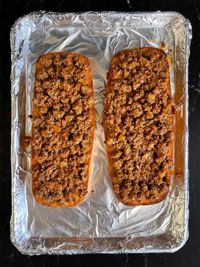 Sloppy joe mixture on top of italian bread.