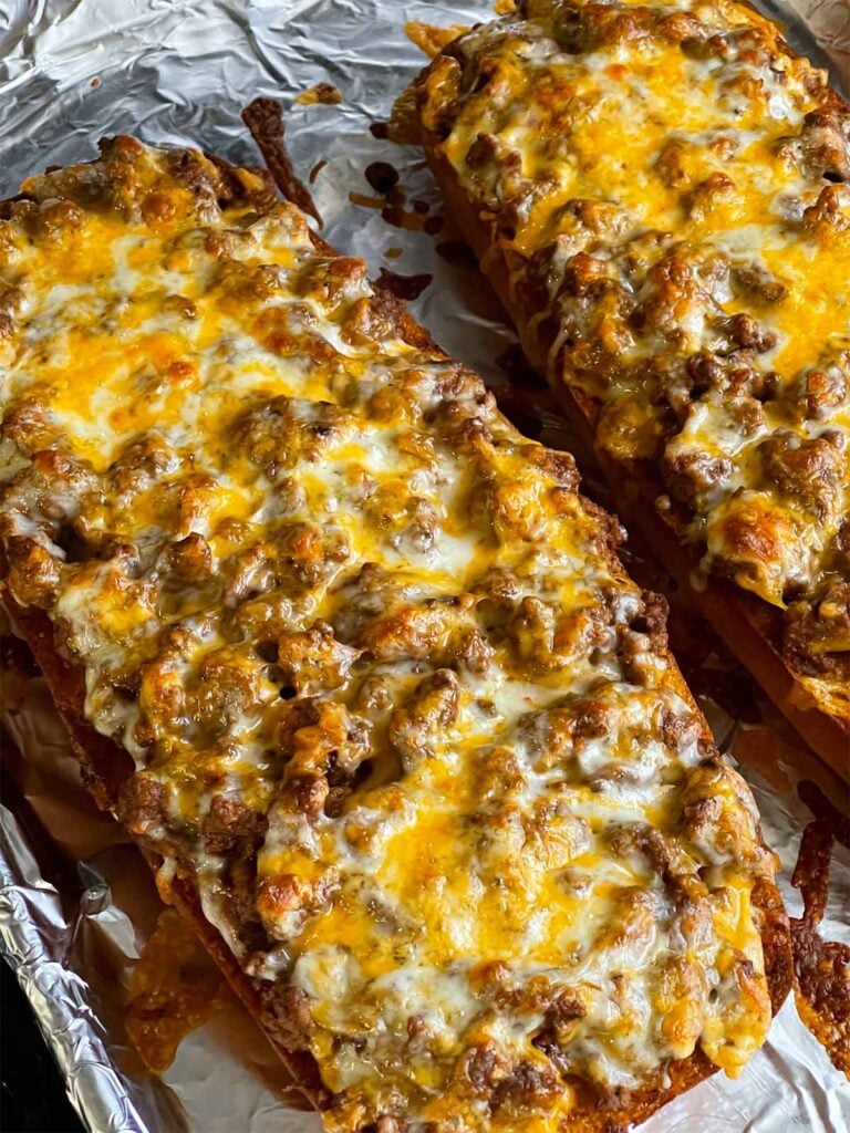 French bread sloppy joes on a baking sheet.