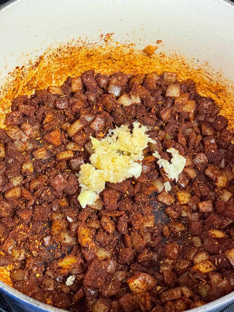 Garlic added to onions and spices for a brisket chili.