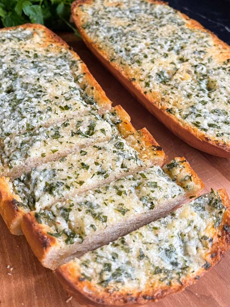 Garlic bread on a cutting board.