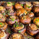 Garlic butter roasted mushrooms on a baking sheet.