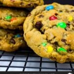 Monster cookies on a wire rack.