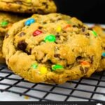 Monster cookies on a wire rack.