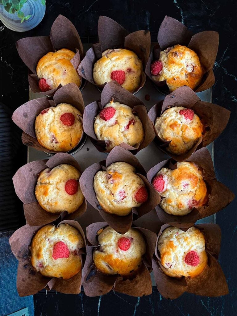 Baked raspberry muffins in the muffin pan.