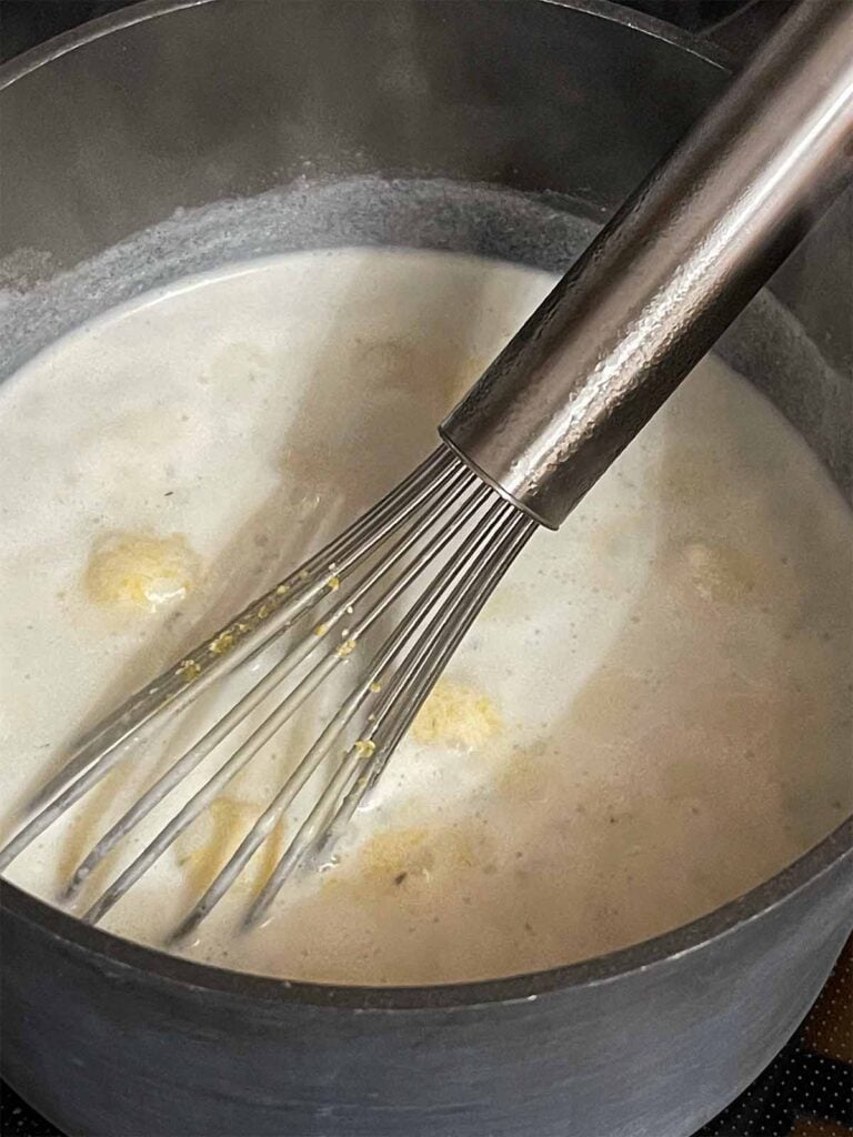 Grits cooking in a saucepan.