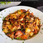 Smoked pulled pork hash garnished with parsley in a white bowl.