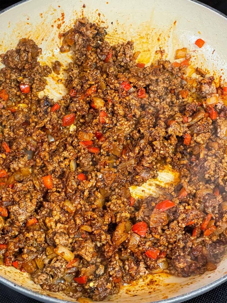 Ground beef mixture in a skillet.