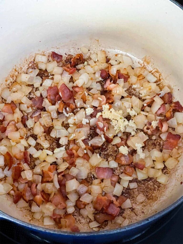 Garlic added to the cooked bacon and onions for southern green beans and potatoes.