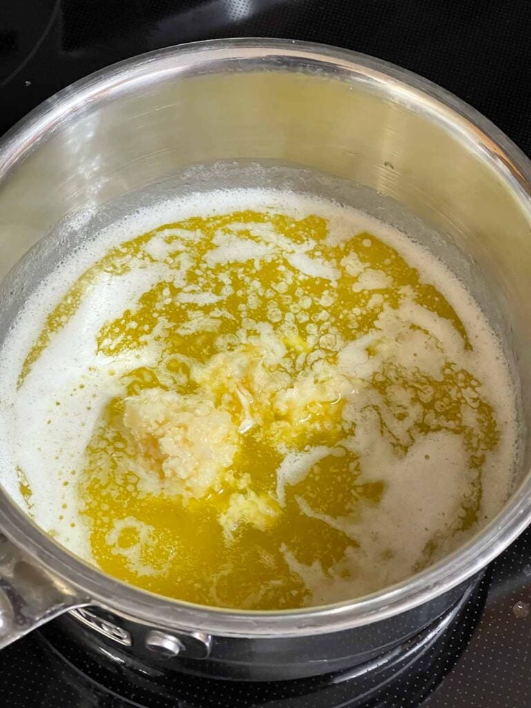 Melted butter in a saucepan.