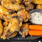 Garlic Parmesan chicken wings on a dark bowl.