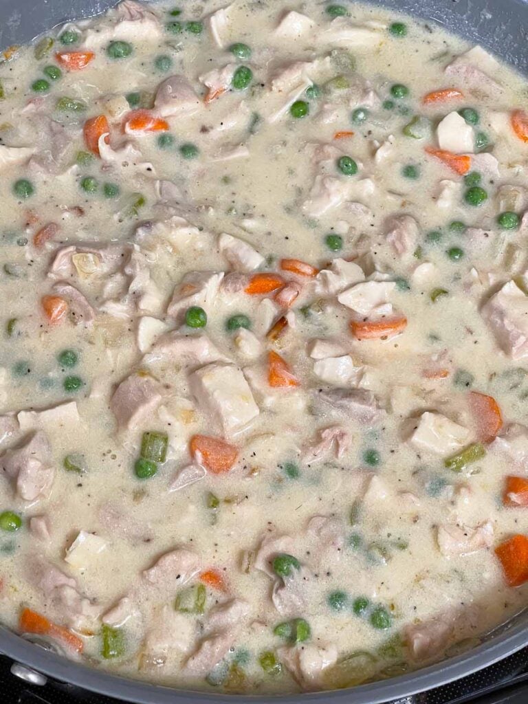 Chicken stuffing casserole mixture in a skillet.