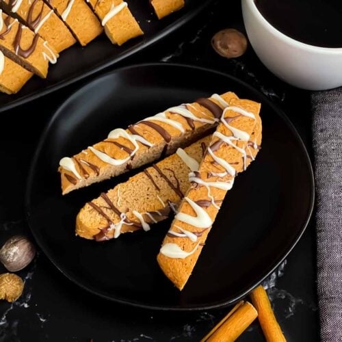 Chai biscotti on a dark plate.