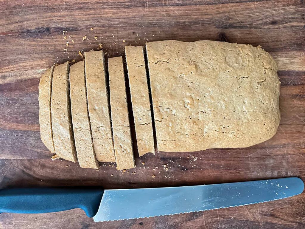 Cutting chai biscotti into cookies.