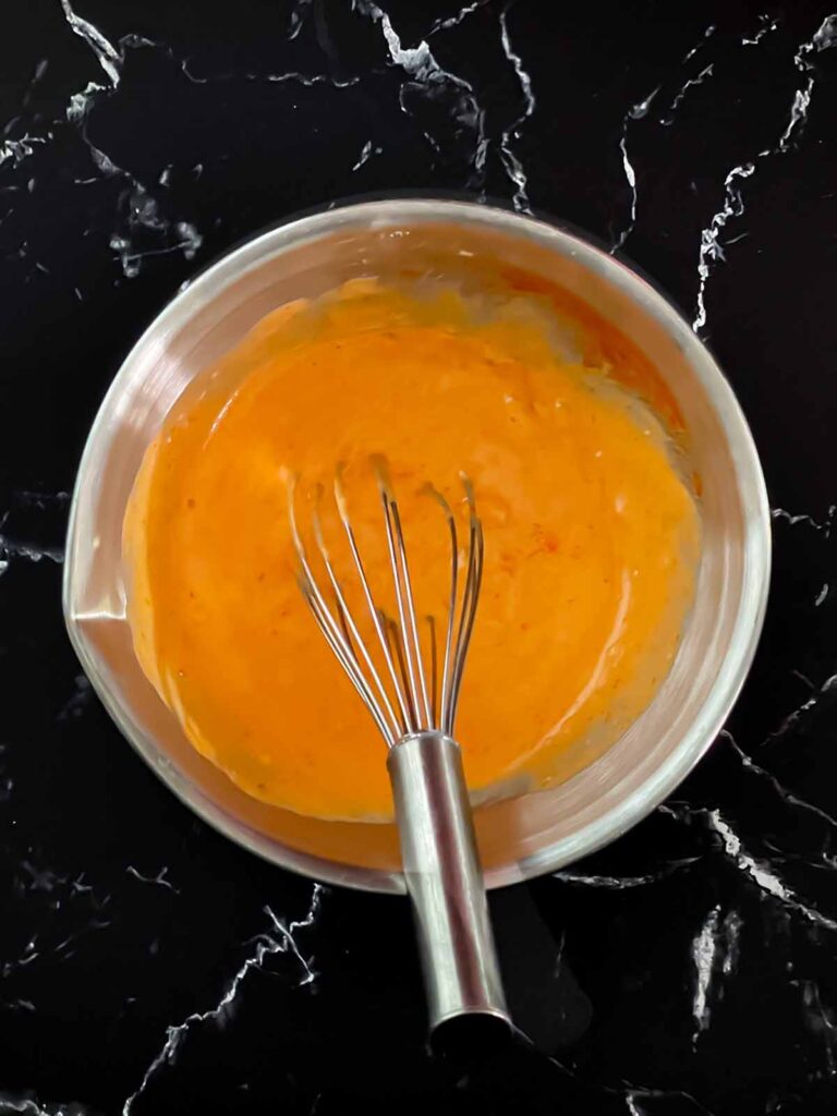 Bang bang sauce mixed in a bowl.